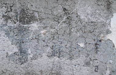 Yaşlı yıpranmış çimento ve beton duvarlar farklı binaların çatlaklar, yakın çekim