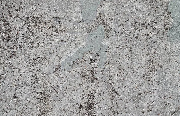 Yaşlı yıpranmış çimento ve beton duvarlar farklı binaların çatlaklar, yakın çekim