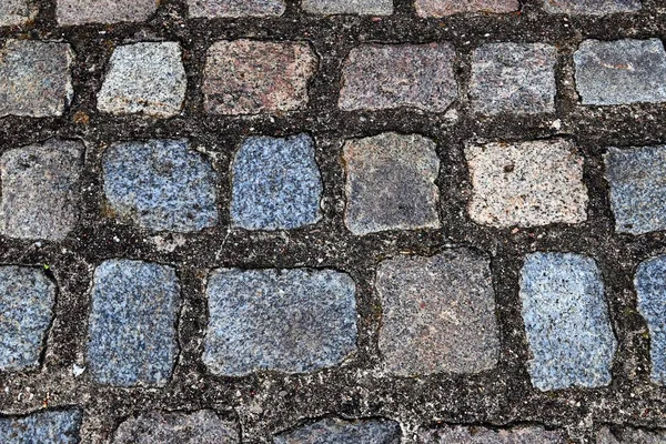 Close up view of different perspective on cobblestone ground surfaces taken on northern germany streets