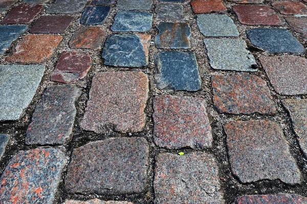 Close up view of different perspective on cobblestone ground surfaces taken on northern germany streets