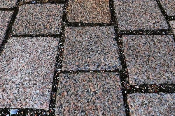 Close up view of different perspective on cobblestone ground surfaces taken on northern germany streets