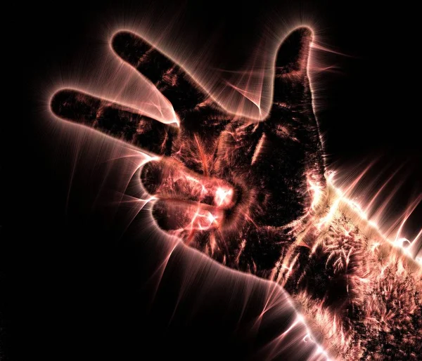 Kirlian aura photography of a glowing human male hand showing different symbols and show of hands