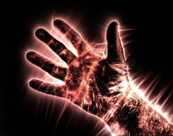 Kirlian aura photography of a glowing human male hand showing different symbols and show of hands