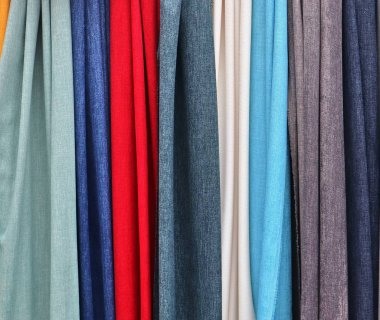 Katlanmış renkli kumaş ve tekstil yüzeyini kapatın ve yüksek çözünürlükte kapatın