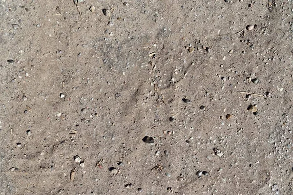 Close up detailed view on sandy ground surfaces in high resolution