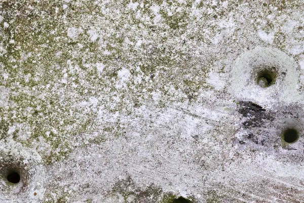 Close up view at multiple bullet holes in a german traffic sign on a countryroad