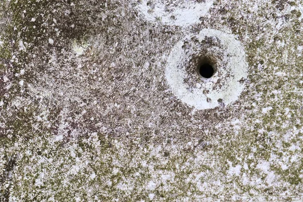 Close up view at multiple bullet holes in a german traffic sign on a countryroad