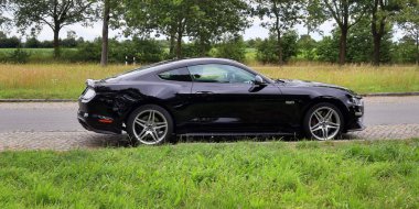 Schleswig-Holstein, Germany - July 17, 2019: Ford Mustang 2018 sports car sunny day view clipart