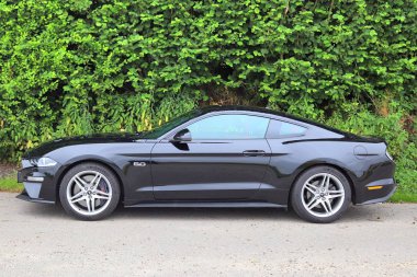 Schleswig-Holstein, Germany - July 17, 2019: Ford Mustang 2018 sports car sunny day view clipart