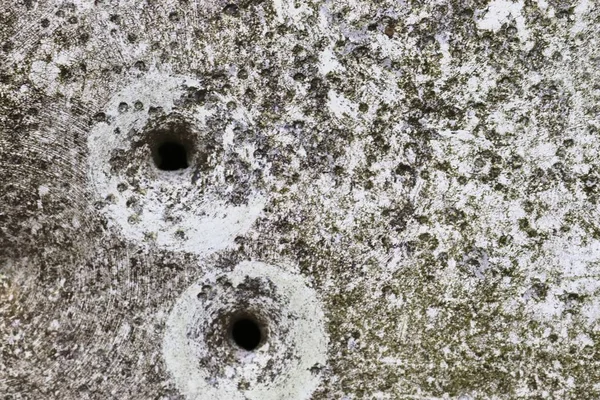 Bullet holes from gun shooting exercises in a german traffic sign