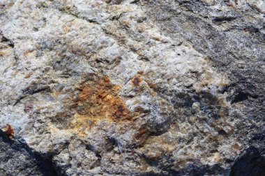 Granit taş dokusu yüksek çözünürlüklü detaylı bir yakın çekim görüntüsüyle.