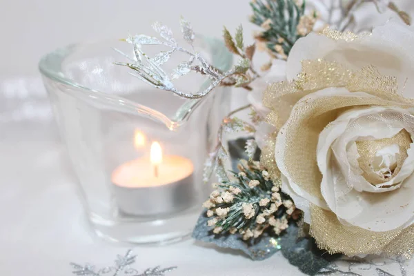 Candle and rose in pastel colors. Background