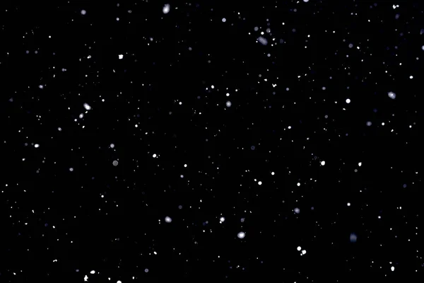 Caduta neve su sfondo nero Fiocchi di neve Volare in aria . — Foto Stock