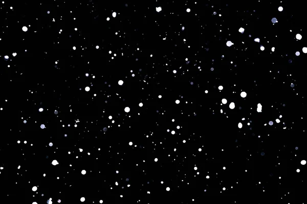 Caduta neve su sfondo nero Fiocchi di neve Volare in aria . Fotografia Stock