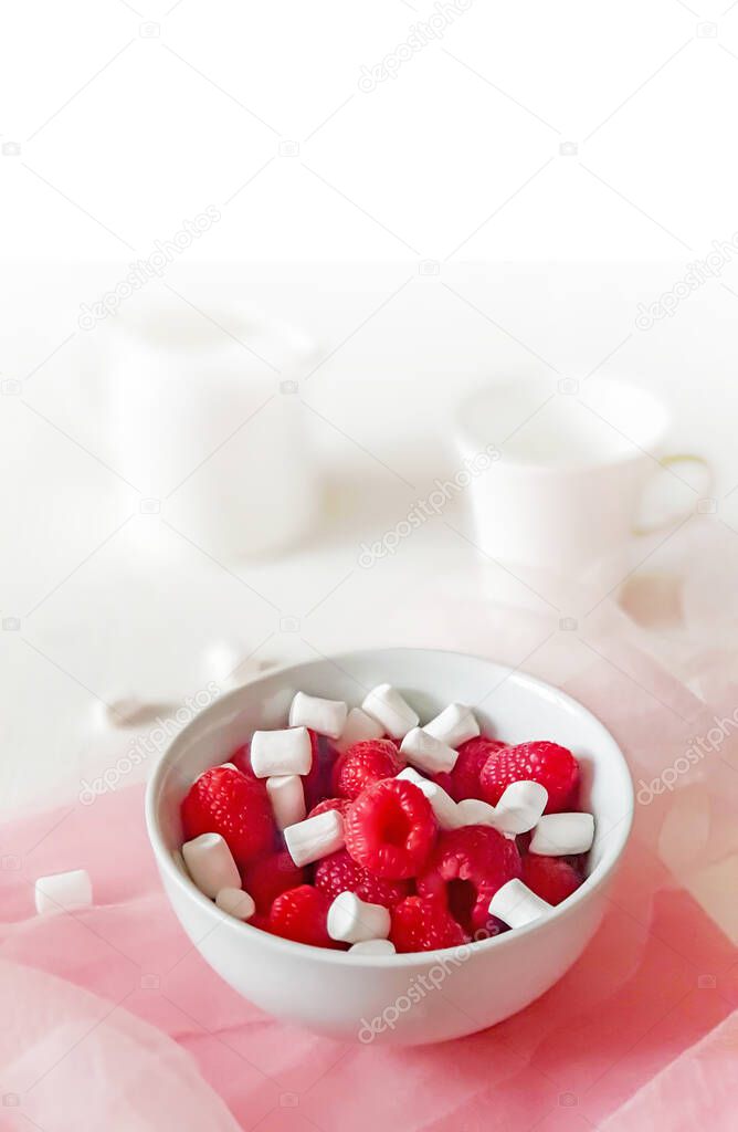 Blurred lifestyle of romantic breakfast with a sweet raspberries, marshmallow and coffee