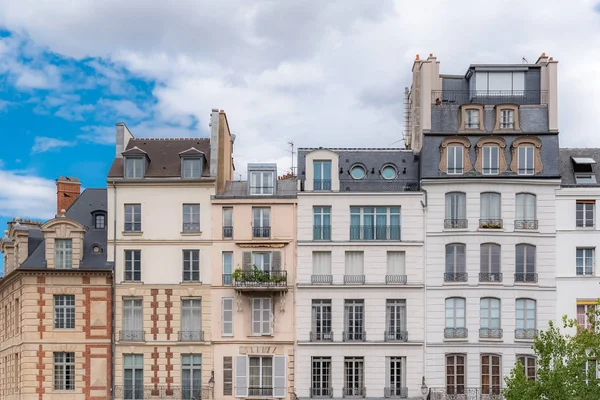 Paris, typical facades in the center, old narrow buildings