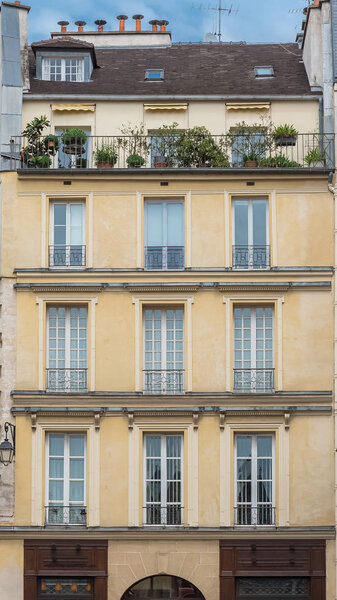 Paris, beautiful building, typical parisian facade in the Marais