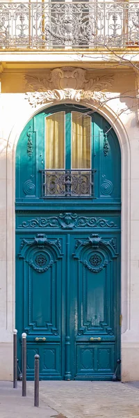 stock image Paris, beautiful wooden door, typical window and balcony