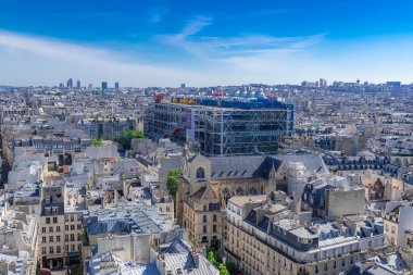 Paris, June 1st, 2019, panorama of the city, with the Pompidou center, and the Saint-Merri church clipart