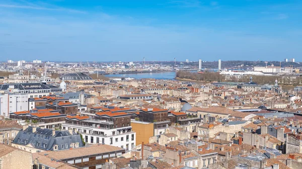 Bordeaux, beautiful french city, typical tiles roofs in the center, with the Garonne river in background