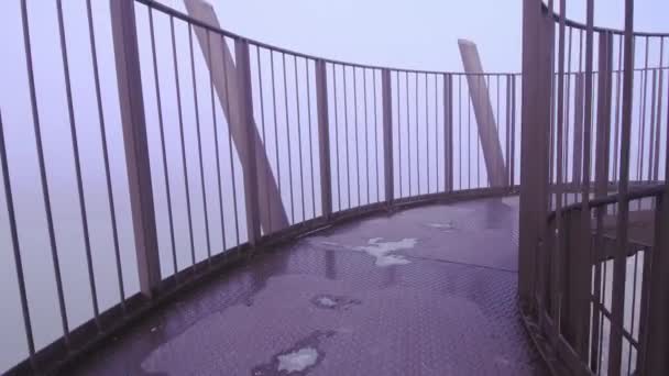 At the top of the tower in the fog — Stock Video