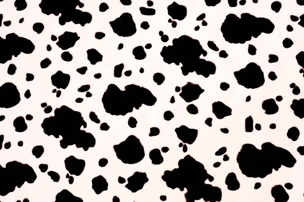 Texture of black spots on a white background