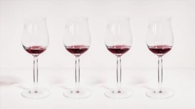 Glasses are filled with wine