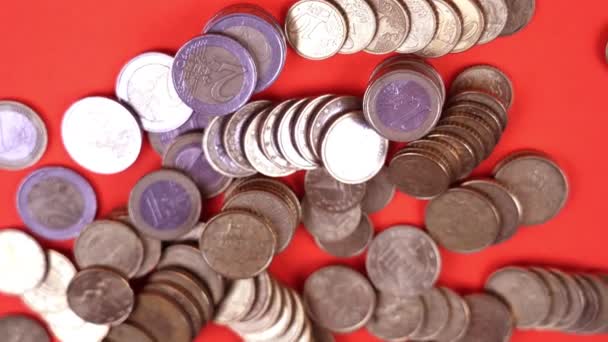 Top view of euro coins scattered on orange surface — Stock Video