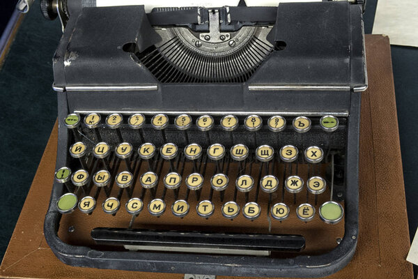 Old vintage typewriter and a blank sheet of paper inserted.