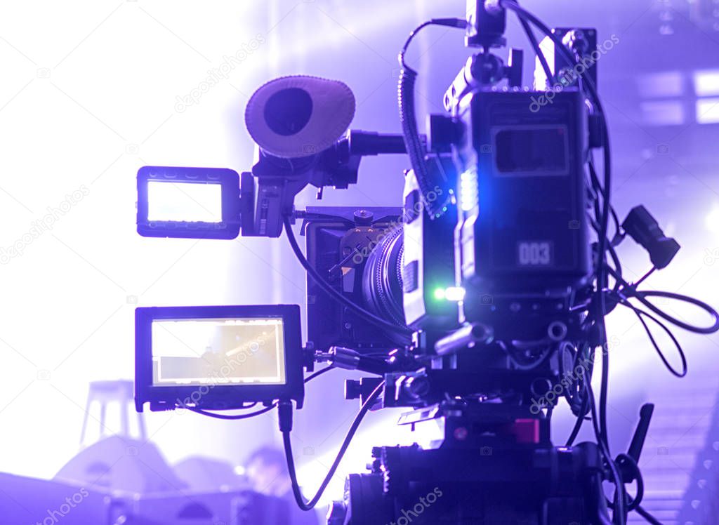 Professional digital video camera. cinematography in a concert hal.