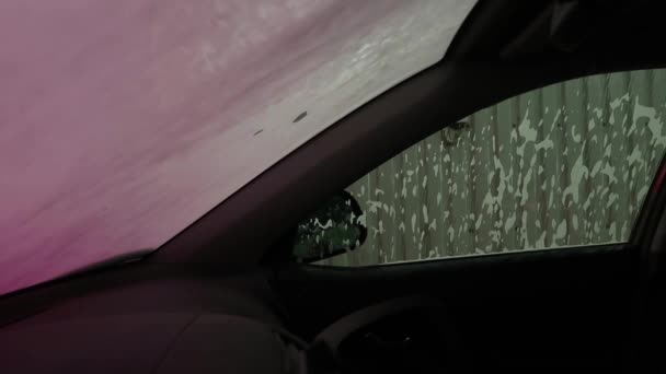 Inside view of a car being washed on an automatic machine. — Stock Video