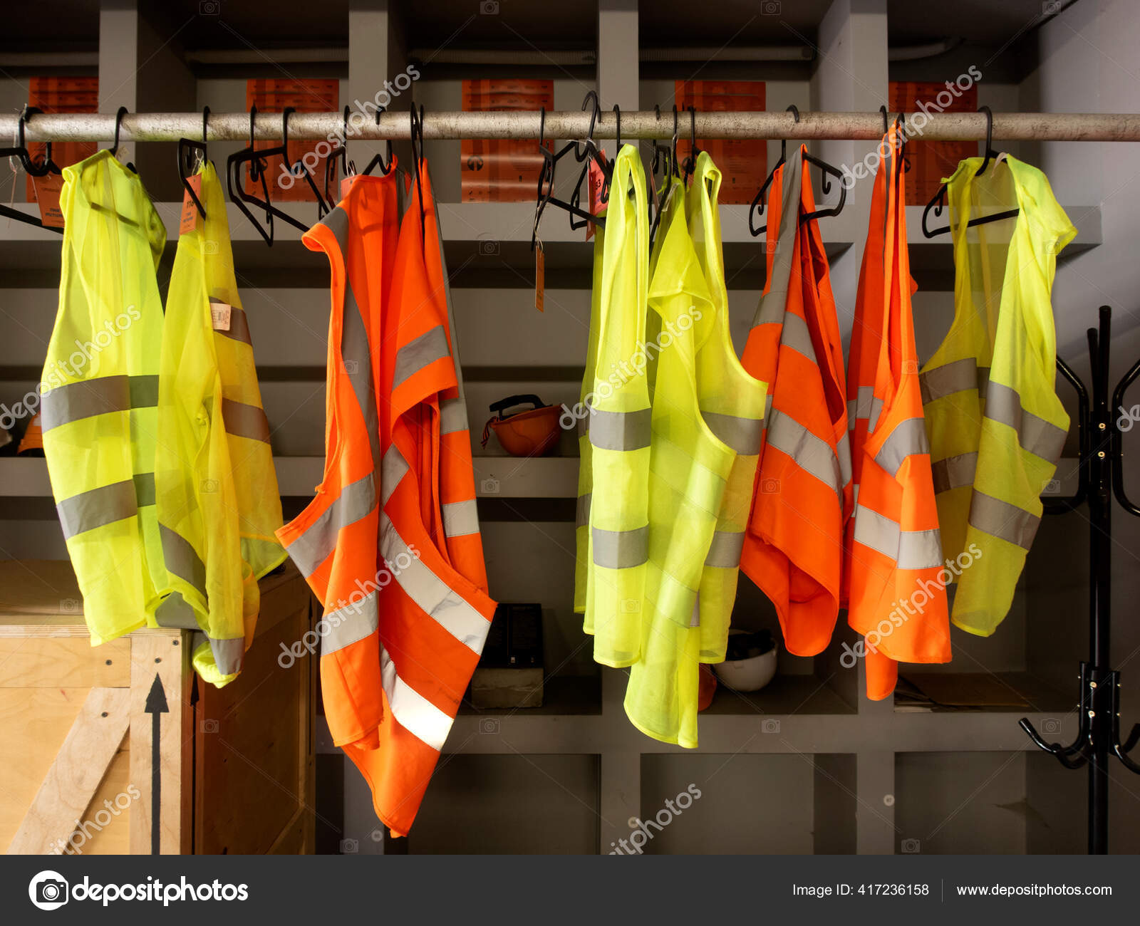 Yellow Work Vests Hanging Hanger Hardhats Safety Jackets Hanger - Main Image