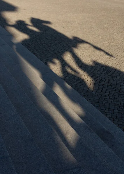 Shadow on the steps of the Old Museum , sculpture The Lion Fighter , Altes Museum on the Museum Island in Berlin