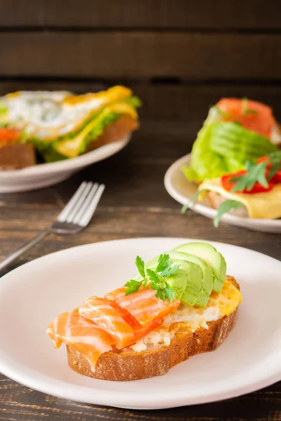 Different Delicious Sandwiches Breakfast Bread Cheese Avocado Trout Sandwich Egg — Stock Photo, Image