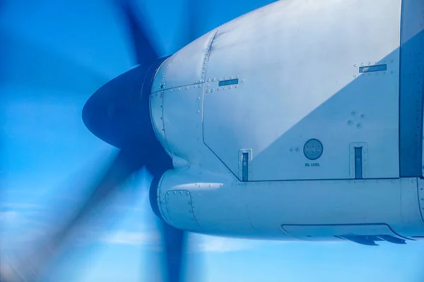 Propeller captured while airplane flying over the sky