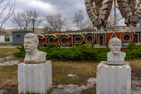 Moscow, Russia, May 29, 2019: Old communist statue of Lenin and Stalin in public green Gorky park