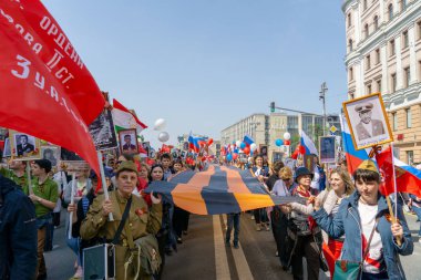 MOSCOW, RUSSIA - MAY 9, 2019: Immortal regiment procession in Victory Day. clipart