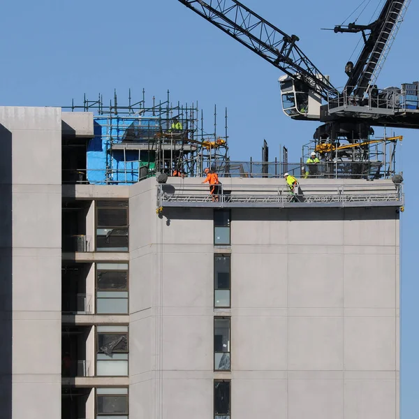 Building work series, progress on the new high rise apartments construction at 277 Mann St, with a Work platform hoist on the structure. External view. Commercial use image. Gosford, Australia - May 12 , 2020: