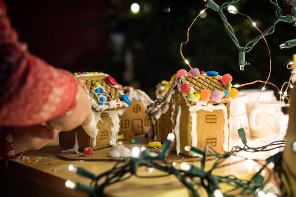 decorated gingerbread house and Christmas lights