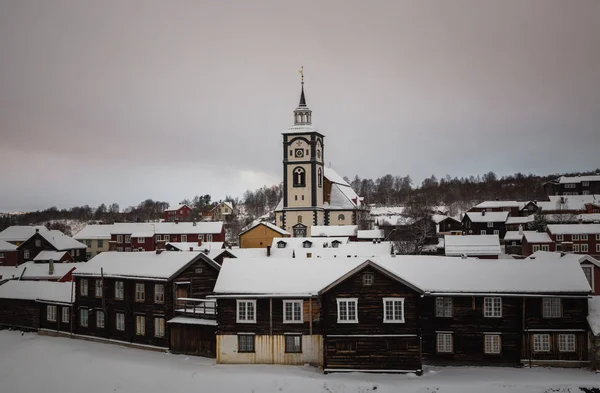 Mining town Roros in Norway, fantastic original old norwegian town, set as a UNESCO World Heritage Site. Traditional wooden architecture. Snowy winter time.