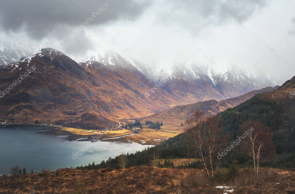 Clouds cover on the tops of Five Sisters of Kintail mountains, Loch Duich area, scottish Highlands.