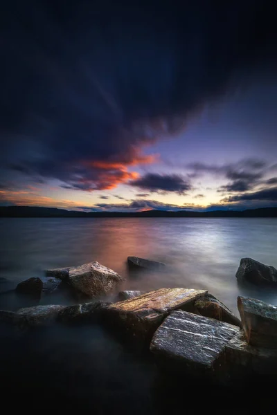 Sunset light and evening mood by the Jonsvatnet lake in Norway.