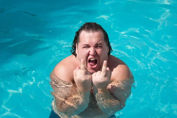 Funny fat man in the pool. Joy and happiness - Stock Image - Everypixel