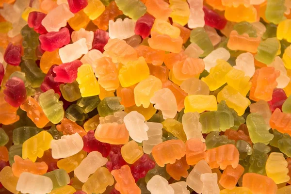 Bakgrunnen for søtsaker. Gummibjørner. Flerfarget bakgrunn . – stockfoto
