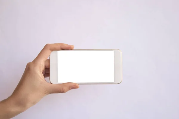 hareket eden telefon ile izole arka plan tutan el