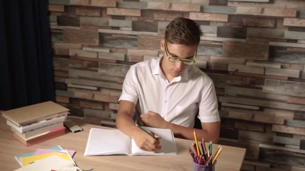 Student Has Finished Doing His Homework Turns Using Remote Control — Stock Video