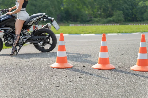 Focus on the traffic cones in driving school. Moto track. Close up — Stock Photo, Image