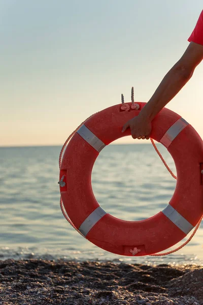 lifebuoy on the beach. Safety on the water.