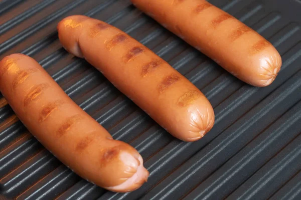 Few cooked sausages on the grill. BBQ — Stock Photo, Image