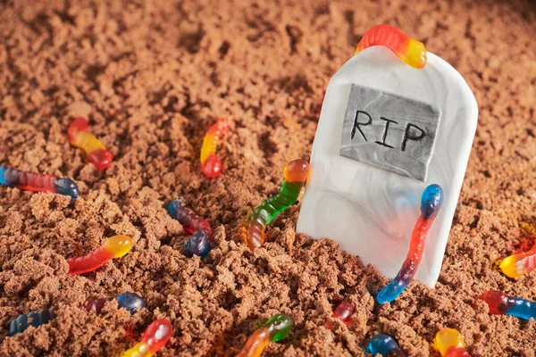 Colorful Bright Assorted Gummy Worms Chocolate Cake Ground Sugar Gravestone — Stock Photo, Image